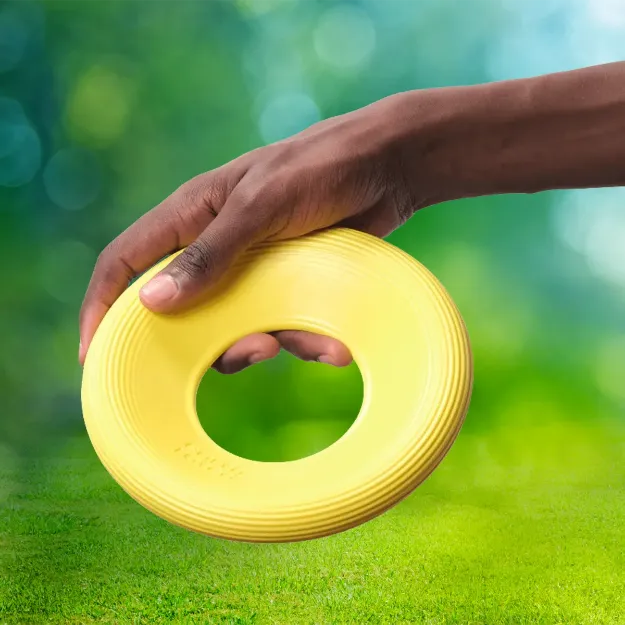 Mjuk och följsam frisbee i knallgult naturgummi